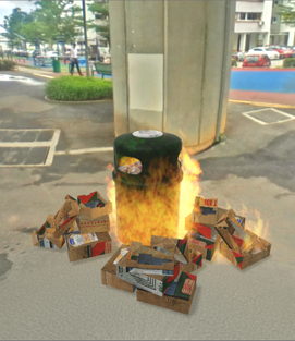 Trash can on fire with trash around it