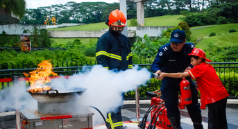 A child learning fire extinguisher training