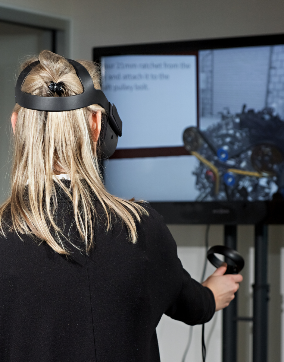 A woman using virtual reality cased to a TV