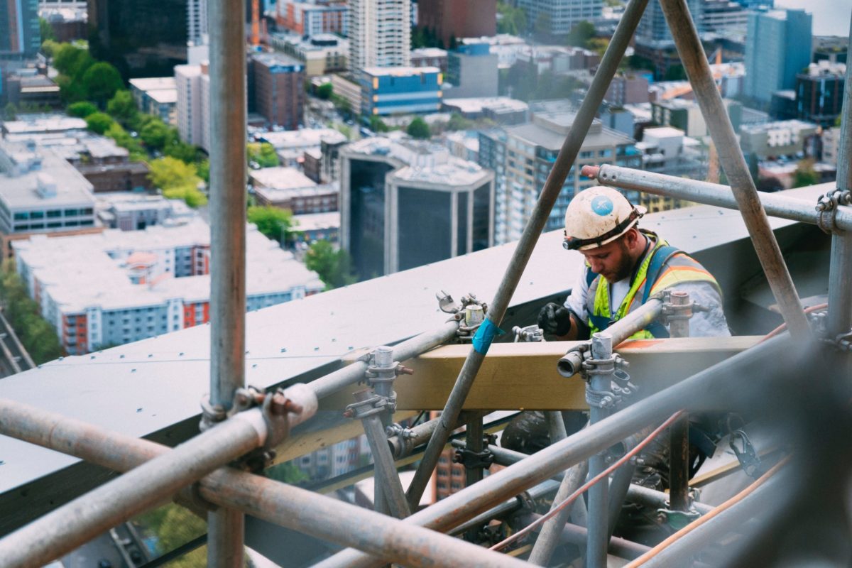 A worker working on a roof of a building