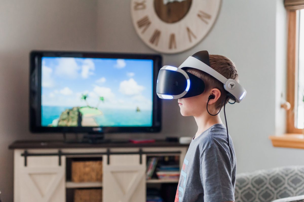 A child using VR with it casting to a TV