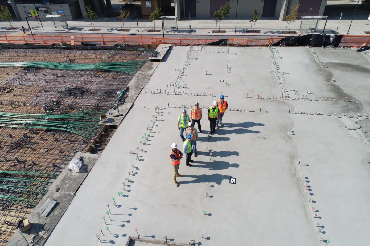 Workers ontop of a roof planning