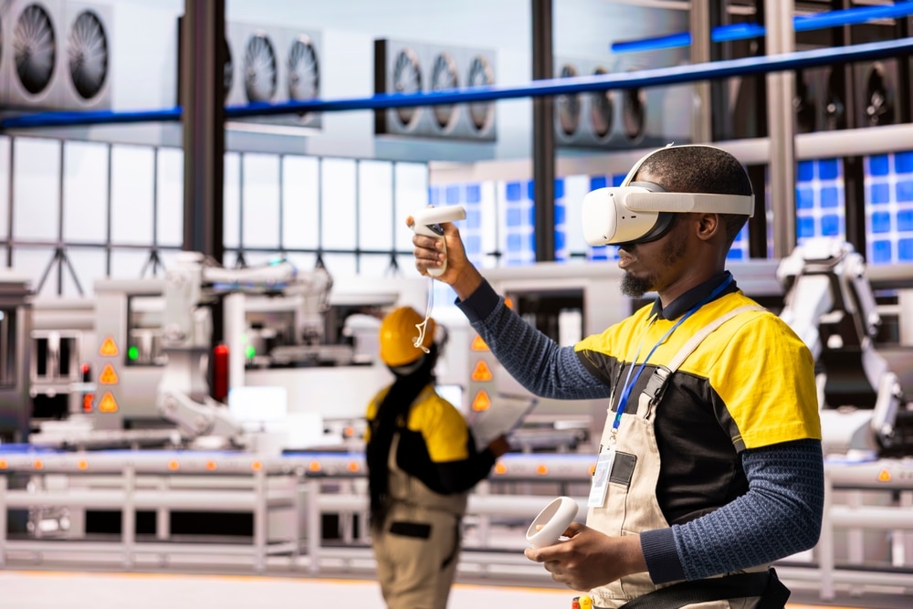 Worker using VR headset on factory floor
