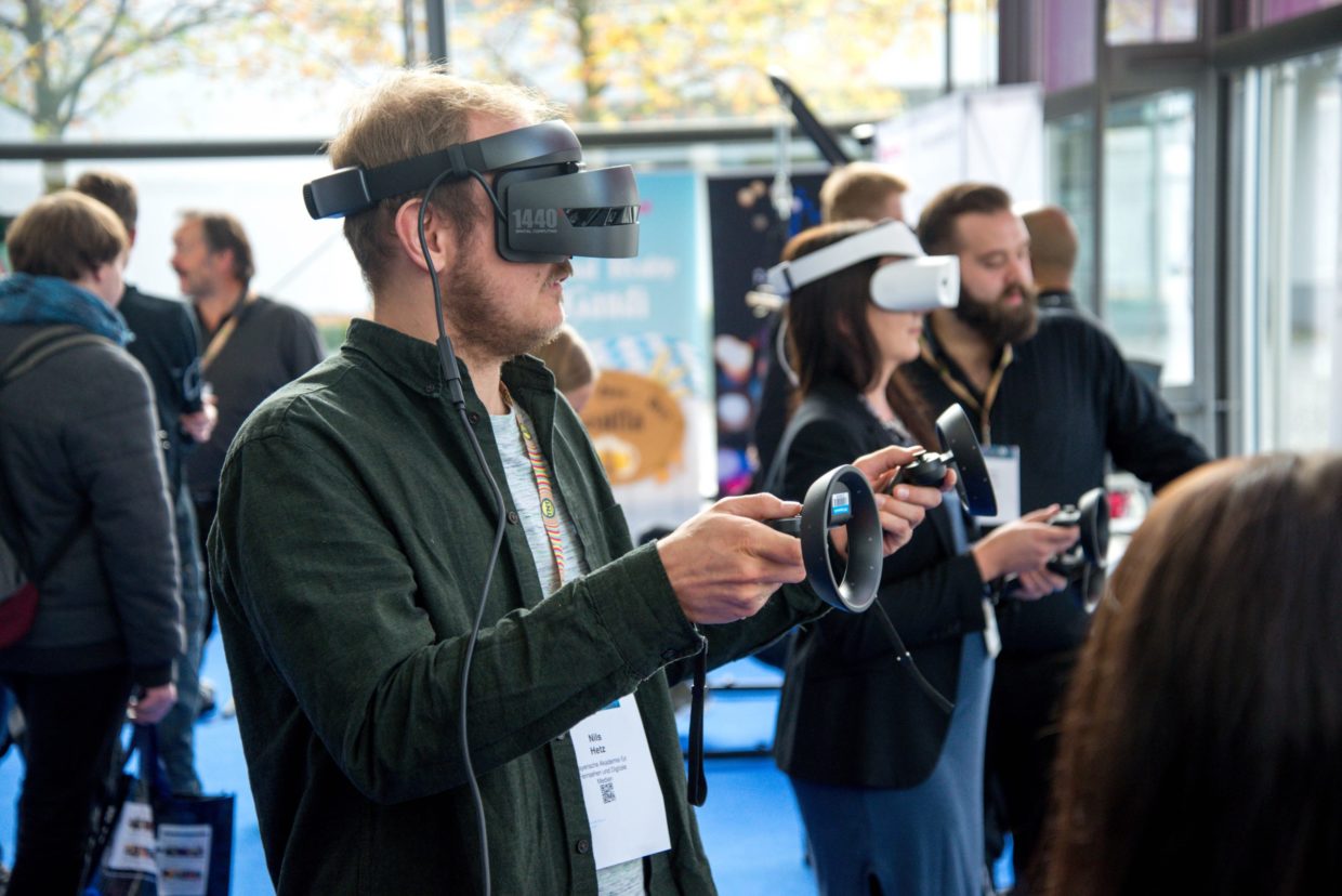 People using VR at a convention