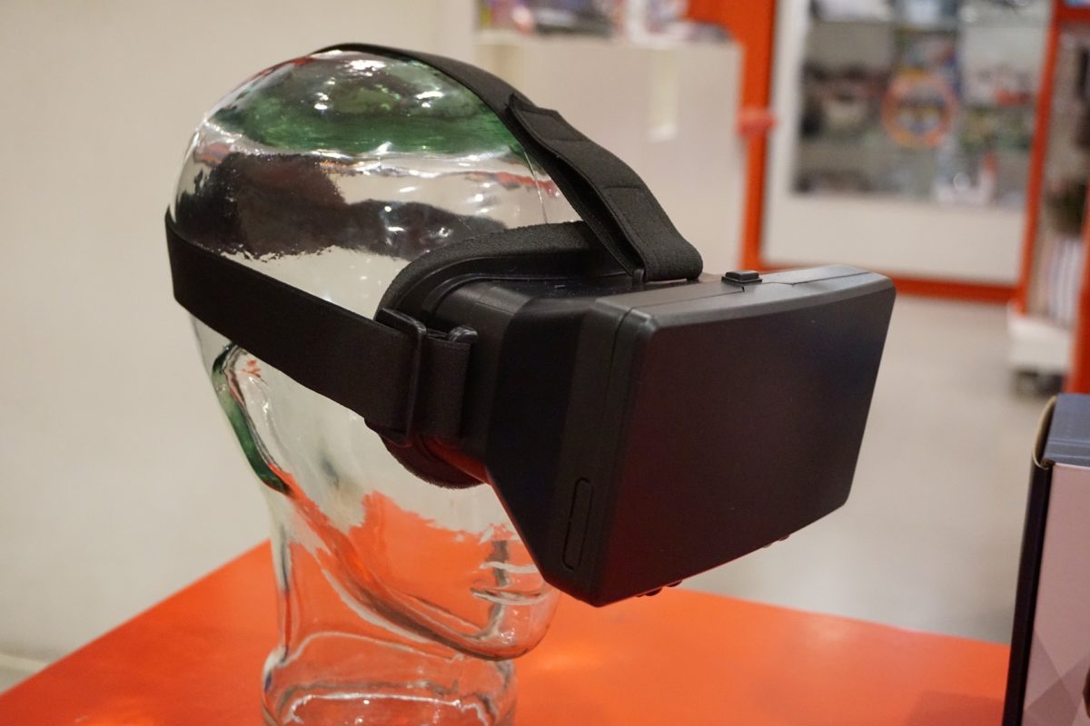 A glass head with a VR headset on