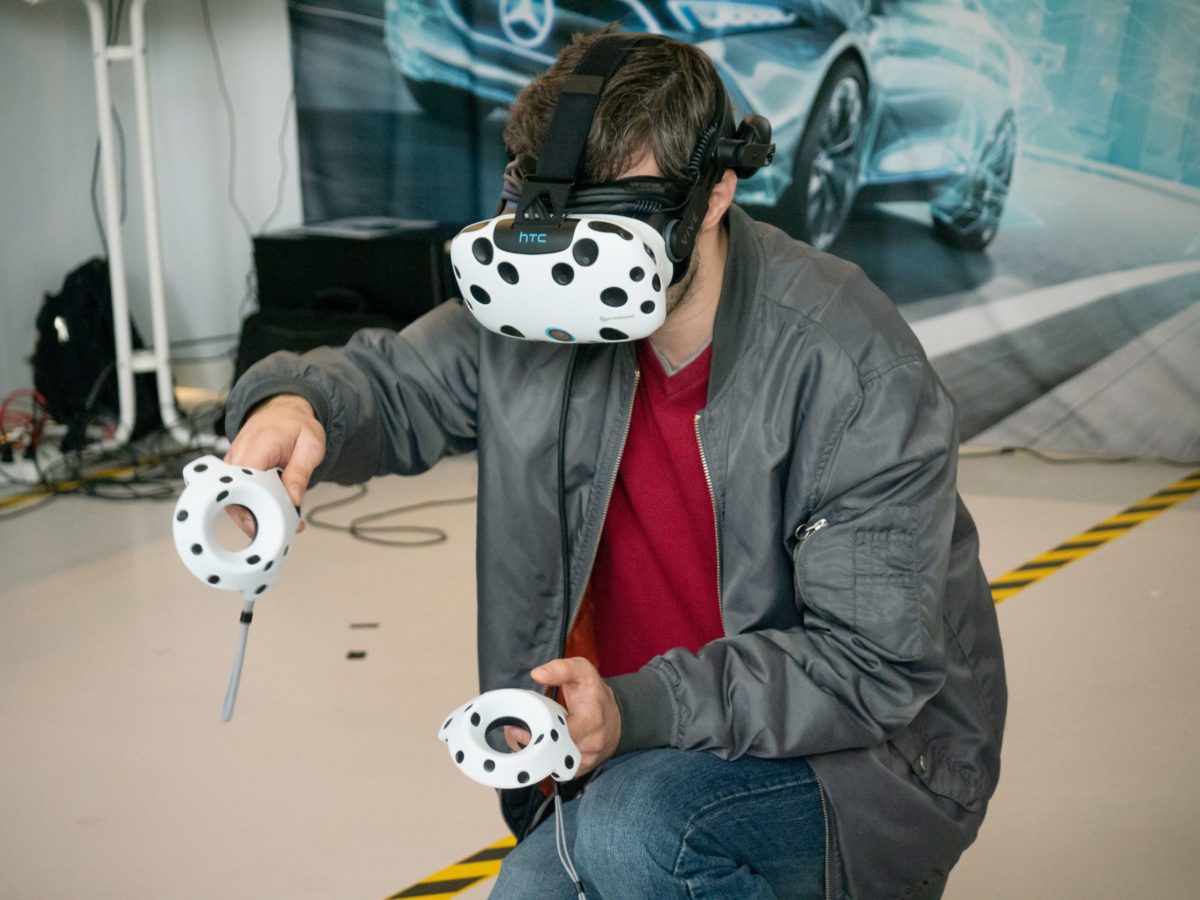 Someone using a VR headset down on one knee